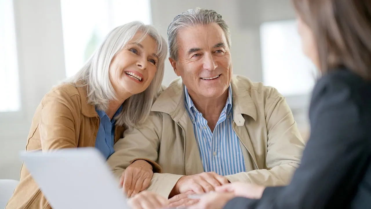 Senior couple meeting financial adviser for investment 1280