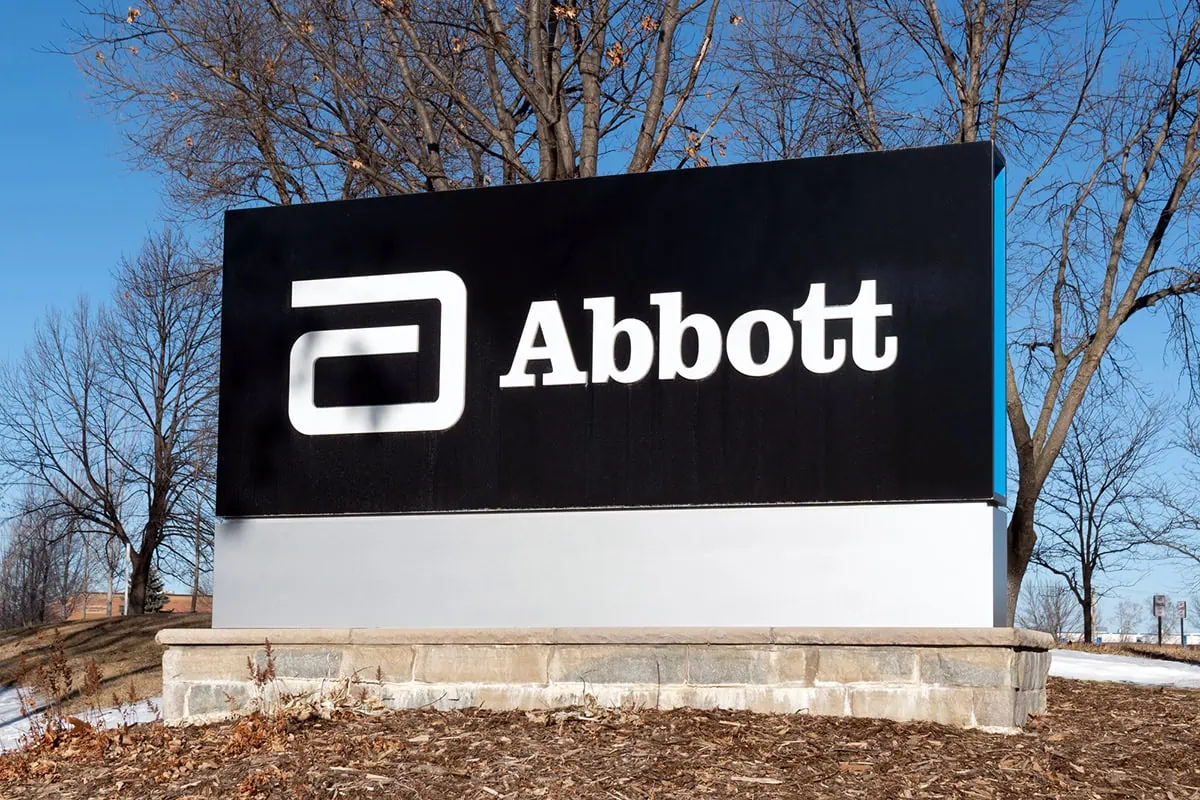 an abbott laboratories sign with a black background.