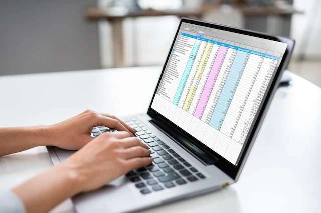 actuary occupation laptop spreadsheet