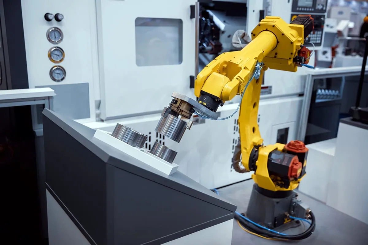 Want to Invest in AI? These 6 ETFs Might Be Your Best Bet 5 a robotic arm works in a factory.