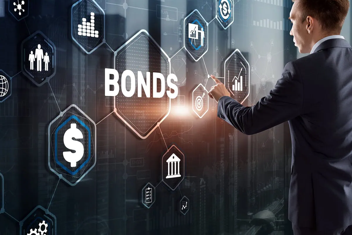 Do You Have Bonds in Your Portfolio? The Argument For Why You Should 4 concept art of a businessman clicking the word bonds on a virtual screen.