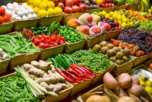 numerous fresh vegetables in a grocery store.