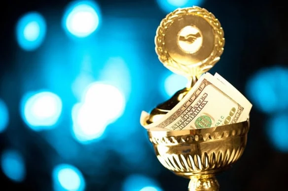 cash sits in a trophy.