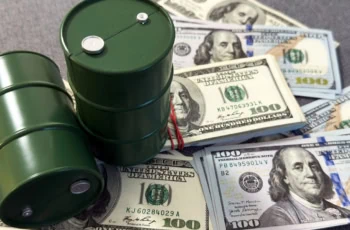 barrels of oil sitting atop stacks of cash.