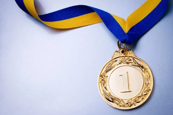 gold medal with a number one on it.