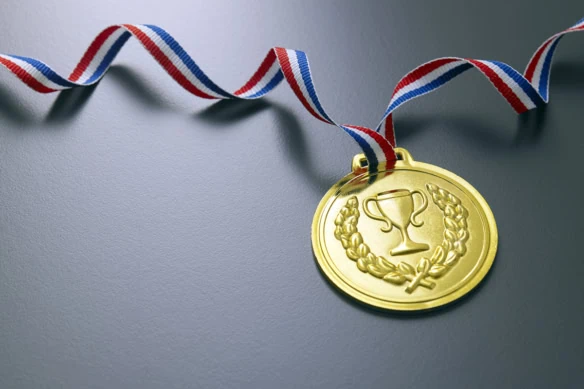 a gold medal with a red-white-and-blue ribbon.