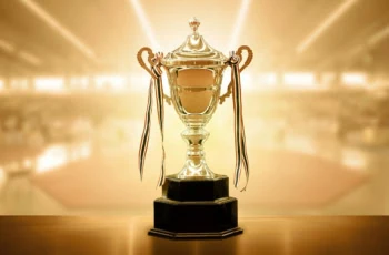 a gold trophy with a shiny gold background.