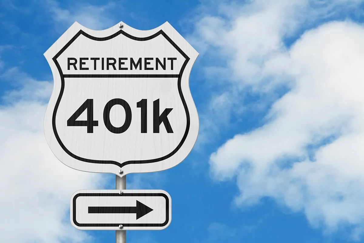 a white road sign that says retirement 401k.
