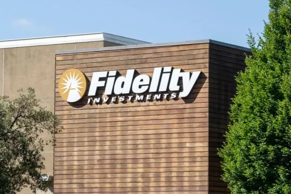A Fidelity Investments sign on the side of a brown building.