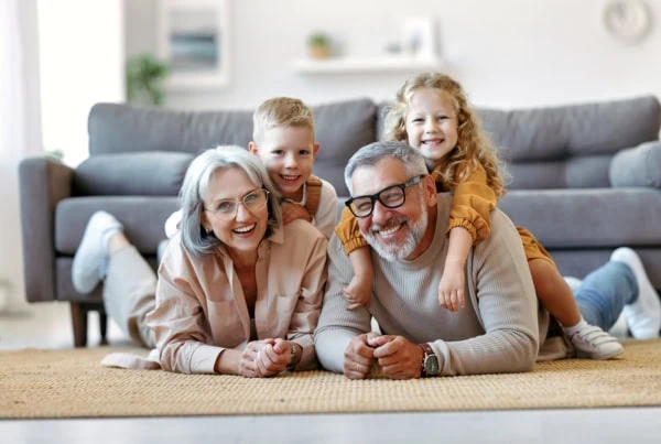 a cheerful family of grandparents and young children.