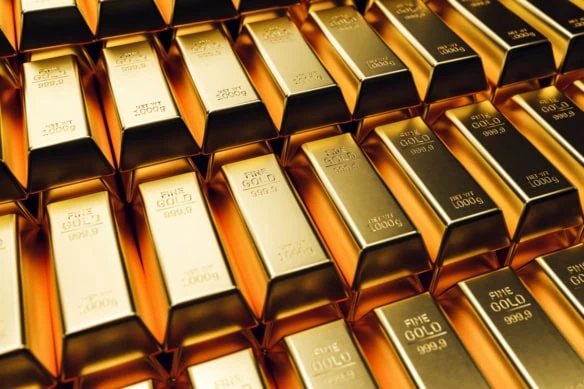 stacked gold bars in a safe.