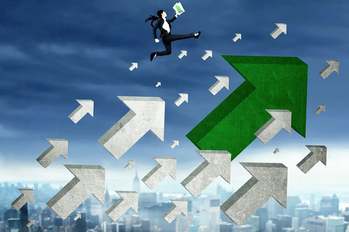 ๐ธ Rookie to Riches: Your Guide to Stock Market Survival 18 concept art of a business person jumping higher amid upward facing arrows flying through the sky.