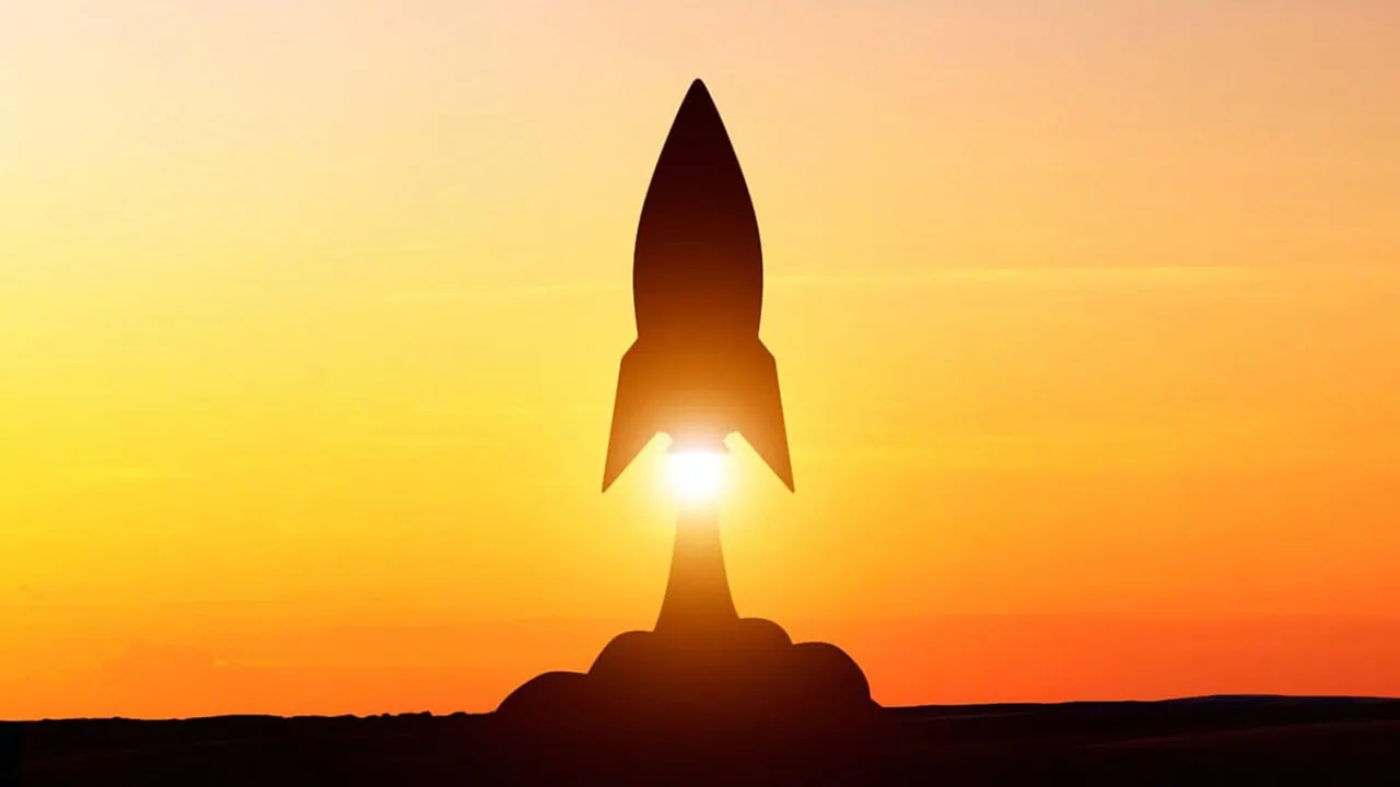 10 ETFs That Are Perfect for Beginning Investors 5 a rocket taking off at sunset.