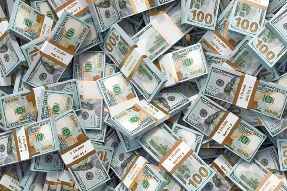 a pile of hundred dollar bills.