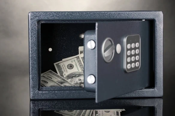 money in an open safe.