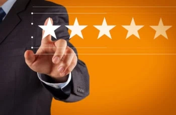 a businessman points to a five-star rating on a digital interface.