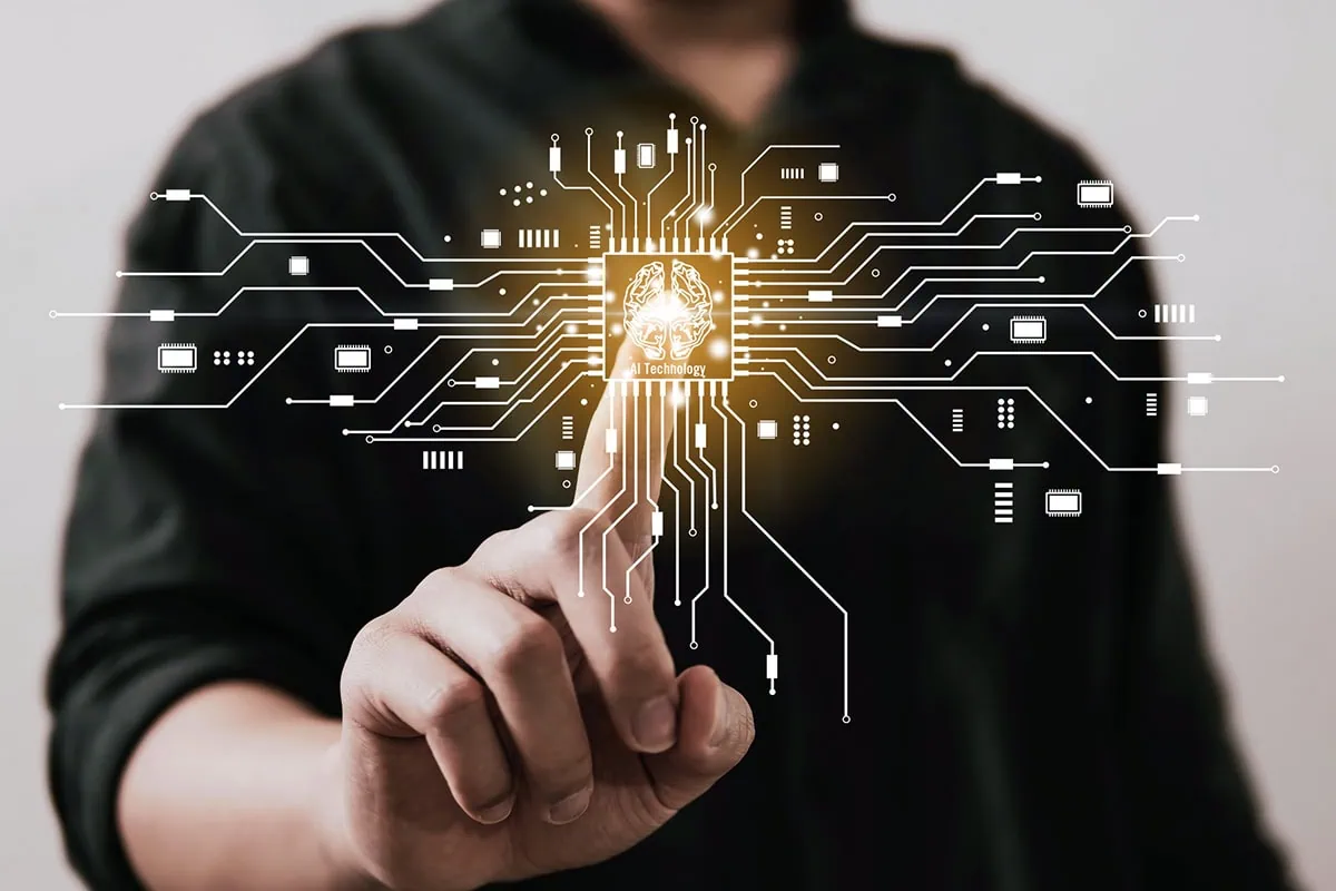 8 Top-Rated Tech Stocks to Buy Now 2 concept art of a man putting his finger on a virtual semiconductor pattern.