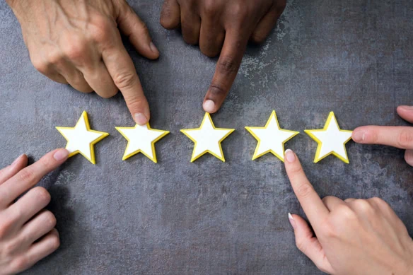 many hands pointing to a five star rating.