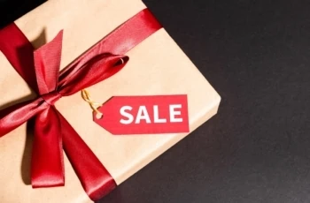 a gift box with a sale sign on it.