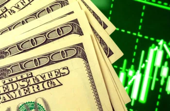 several hundred dollar bills over over a stock chart showing growth.