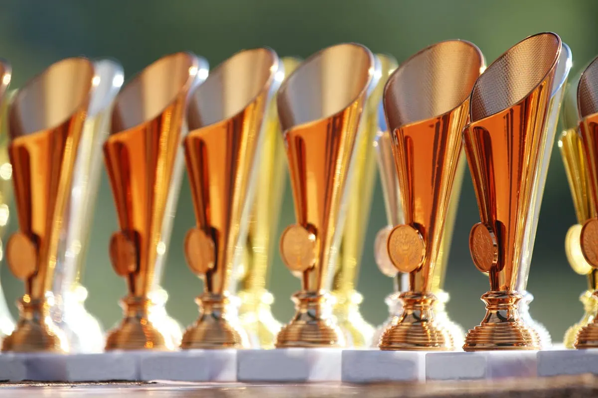 a line of gold trophies.