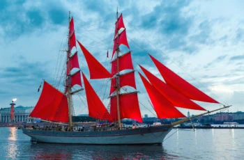 Swedish brig Tre Krunur a ship with big red flags resembling the vanguard logo.