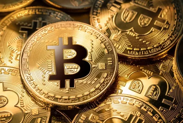 gold bitcoin coins on a gold background.