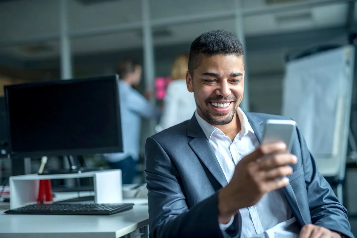 businessman investor smartphone investing app 1200