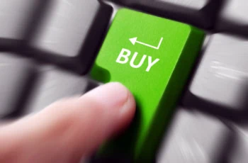 a person presses a keyboard button that says buy.