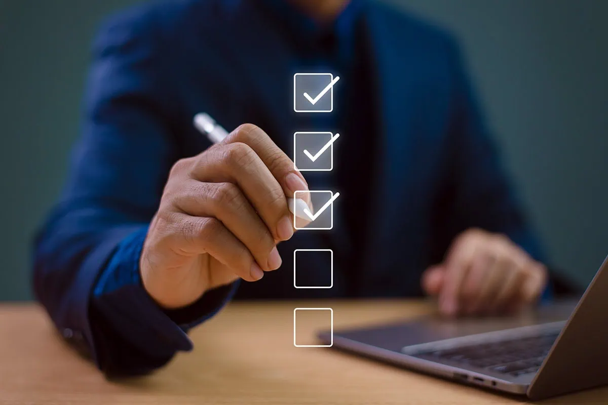 a person checking off a virtual checklist.