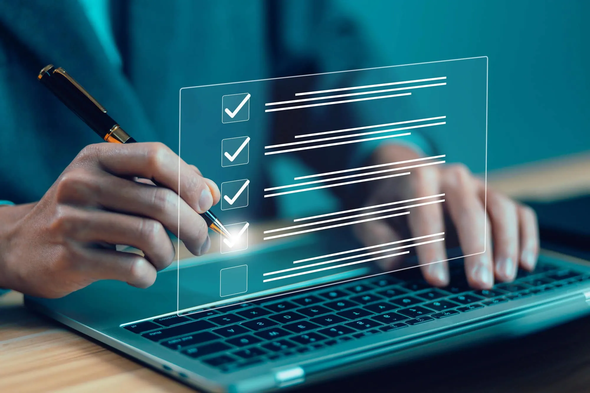 a person looks at a virtual checklist while typing at the computer.
