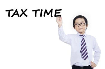 Little boy writes tax time