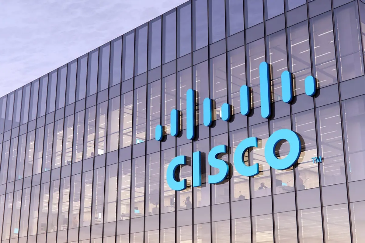 These 5 Tech Stocks Pay Us Something Extra on the Side 4 Cisco sign on the side of a glass building.