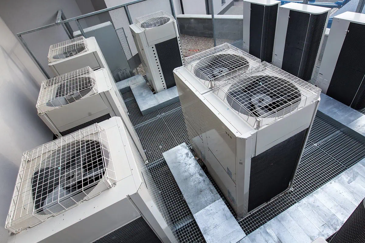 7 Best Growth Stocks You Can Buy Right Now 12 Air conditioning equipment atop a modern building.