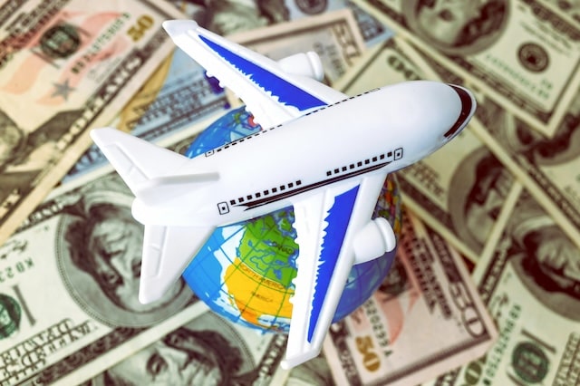 consumer fees airport plane dollars globe