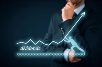 a hologram of a charge showing dividend rising superimposed against a thinking businessman.