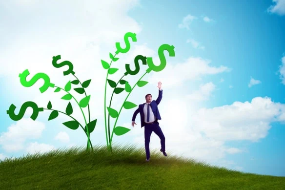 a man reaches for the tops of vines that have dollar signs growing out of them.