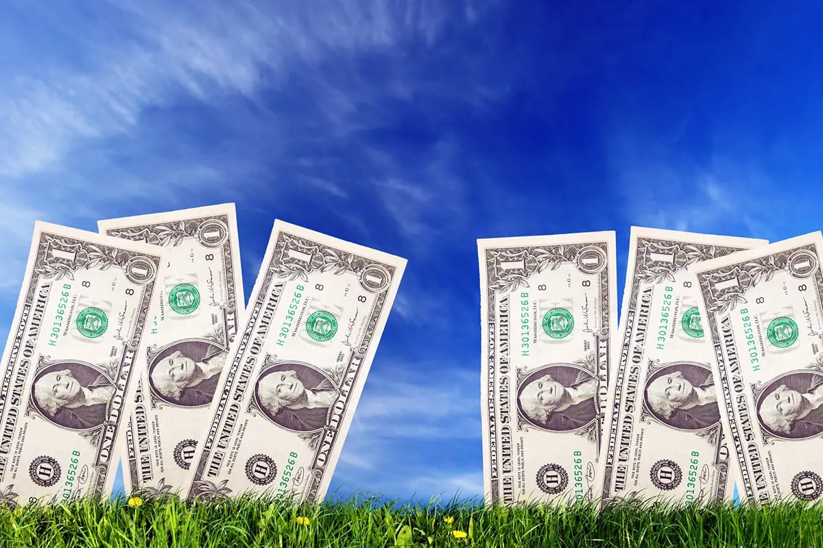 Financial Fables: 18 Social Security Myths to Ignore 3 one dollar bills grow out of the ground.