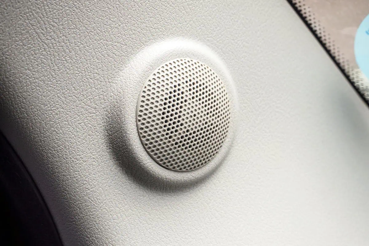 5 Tech Stocks You Can Buy (For the Dividends) 11 A close-up of a speaker on the side panel of a car.