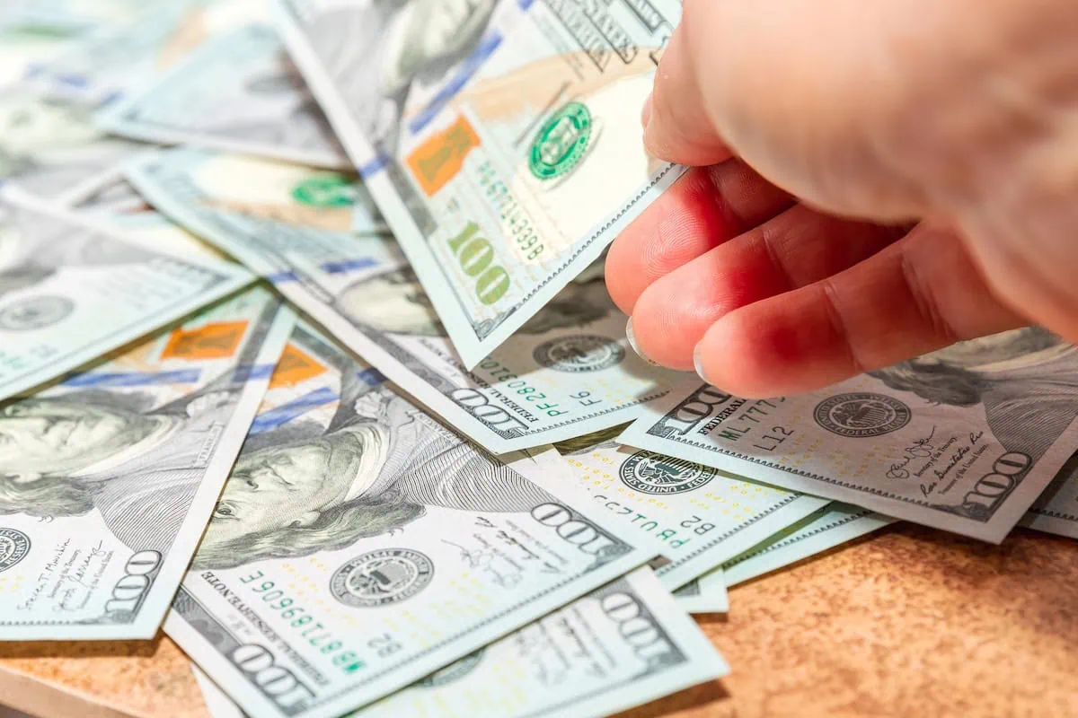 Is Your Name on a Missing Money Registry? How to Find Unclaimed Property Owed to You 2 dollar bills unclaimed property money