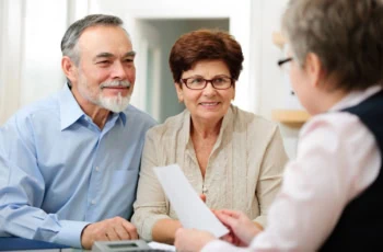 elderly couple meeting with accountant