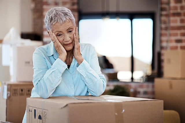 elderly moving house boxes unhappy