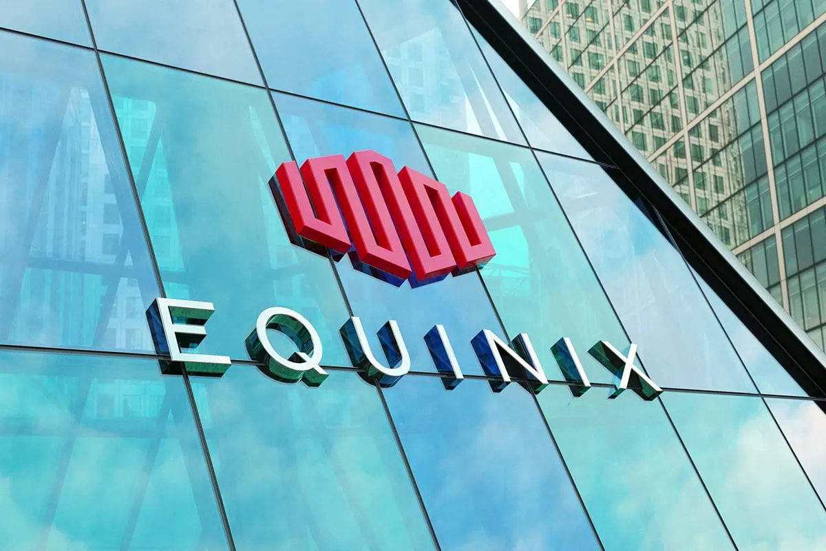 equinix logo on the side of a blue glass building.