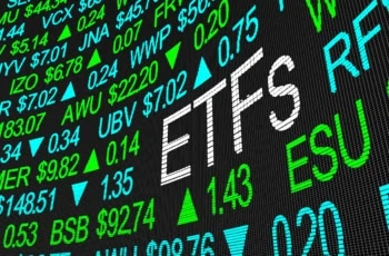 a stock tickerboard with the word ETFs spelled out in larger lettering than the rest.