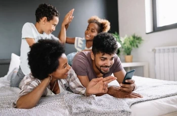 family mom dad kids children smartphone