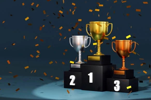 trophies sitting on an awards podium.