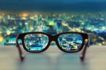 a night cityscape focused through glass lenses.