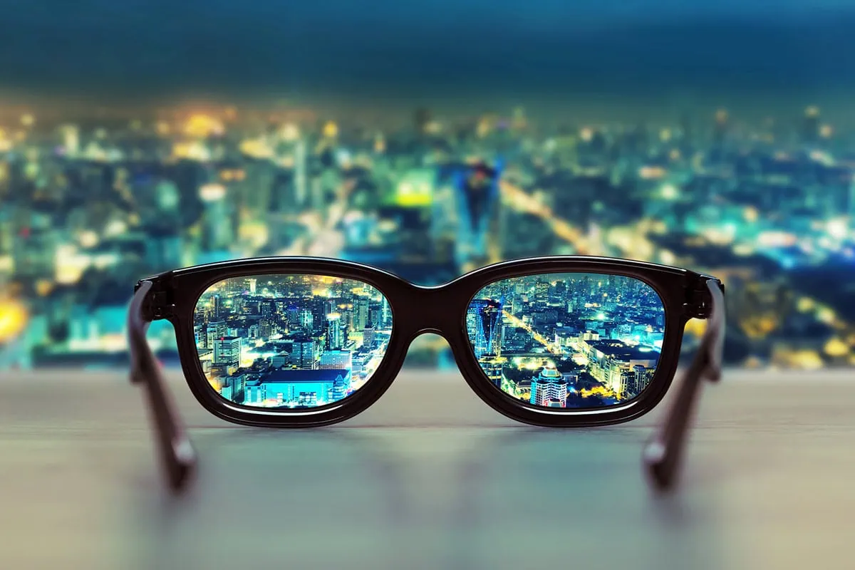 a night cityscape focused through glass lenses.