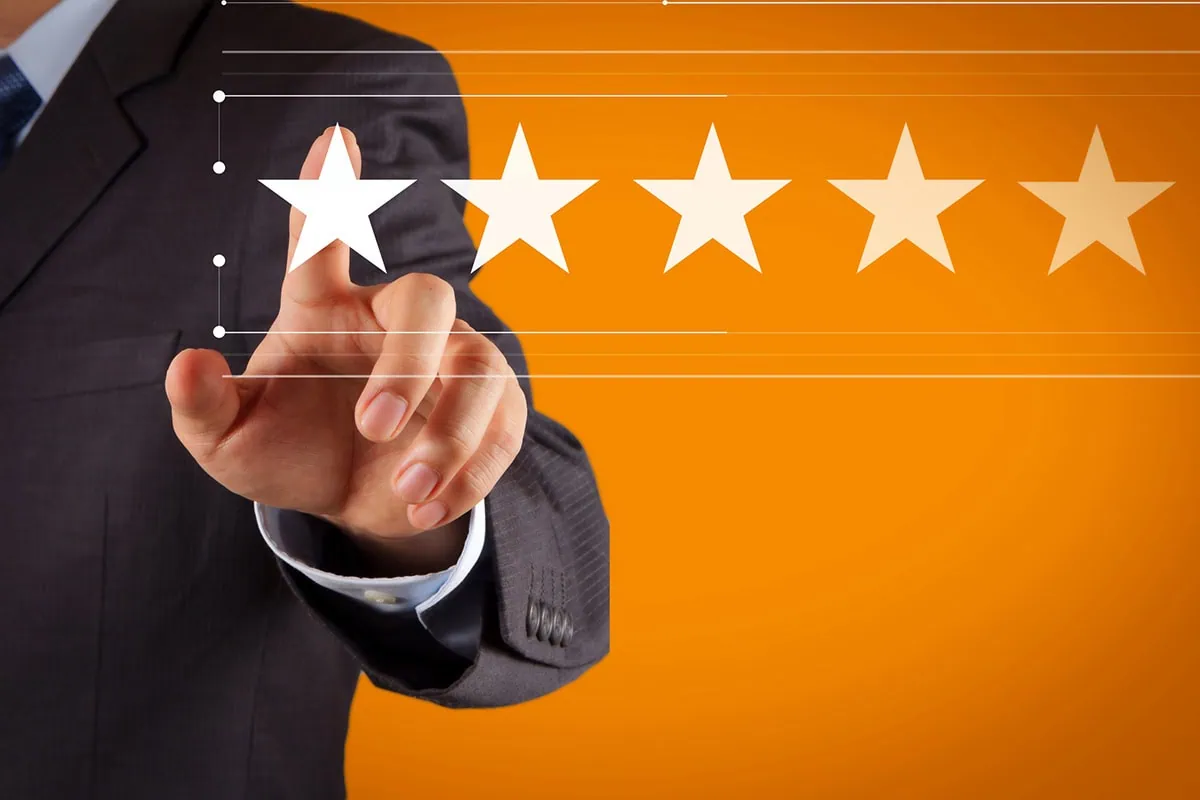 a businessman points to a five-star rating on a digital interface.
