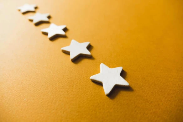 five white stars on an orange background